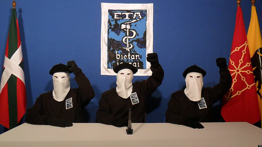 UNSPECIFIED - UNDATED:  In this undated image provided by Gara, three Eta militants pose in front of the group's symbol of a snake coiled around an axe, in support of a declaration released on October 20, 2011 stating a "definitive cessation" to it's four decade long campaign of armed conflict in seeking an independent Basque homeland from Spain and France.  (Photo released by Gara via Getty Images)