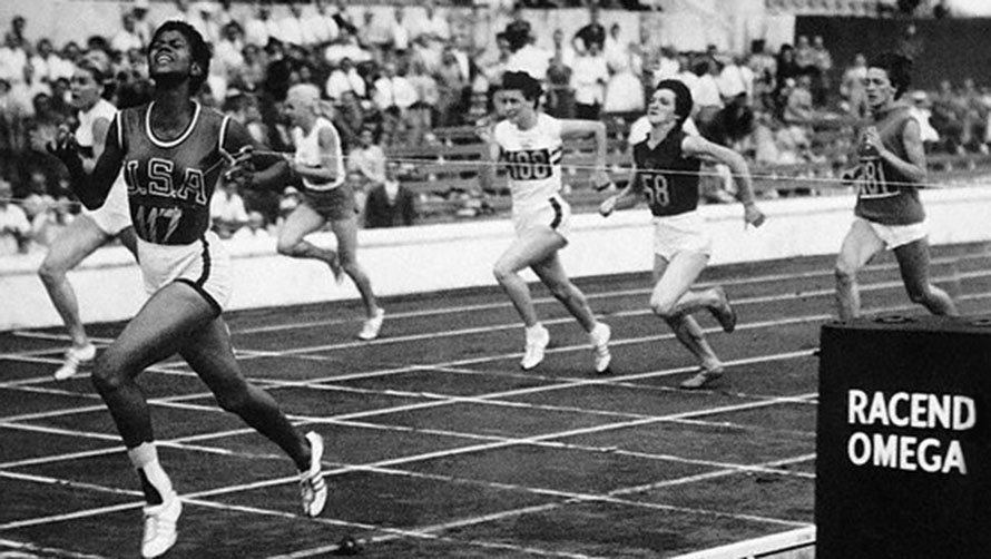 03 Sep 1960, Rome, Italy --- American Wilma Rudolph crosses the finish line in a women's sprint event at the 1960 Summer Olympics in Rome, Italy. September 3, 1960. --- Image by © Bettmann/CORBIS