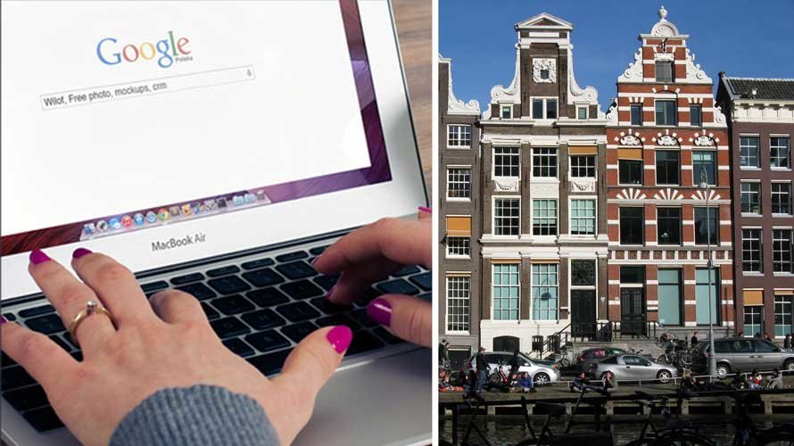 Imagen de archivo de una mujer haciendo una búsqueda en internet y los edificios de una de las calles de Amsterdam. ARCHIVO