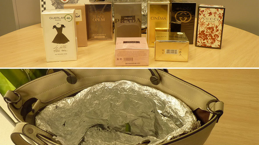 Algunos de los perfumes hallados en el interior del bolso forrado con papel alumnio para evitar las alarmas. POLICÍA MUNICIPAL