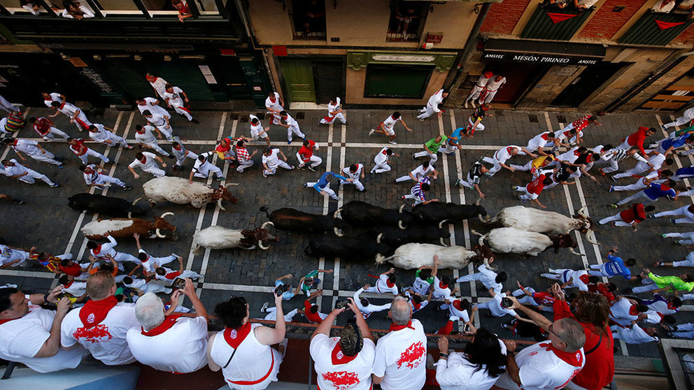 A reveller is helped by medical staff during the running of the bulls at the San Fermin festival in Pamplona, Spain, July 10, 2019.