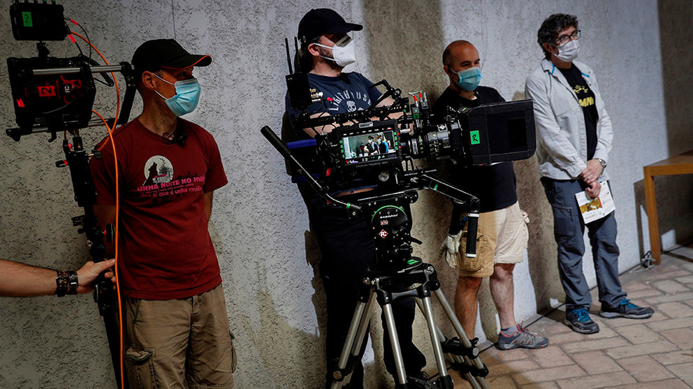 The director of the series 'Tres Caminos' (lit. Three Ways), Norberto Lopez (R), and other members of his team wear facial protective masks during the filming of the Amazon Prime Video, Ficcion Producciones and Beta Films joint production at Condestable Palace in Pamplona, Spain, 26 May 2020. The series narrates the story of five people of different nationalities that become friends as they walk St James' Way. EFE/ Villar Lopez
